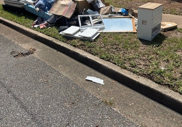 Curbside junk pile before removal